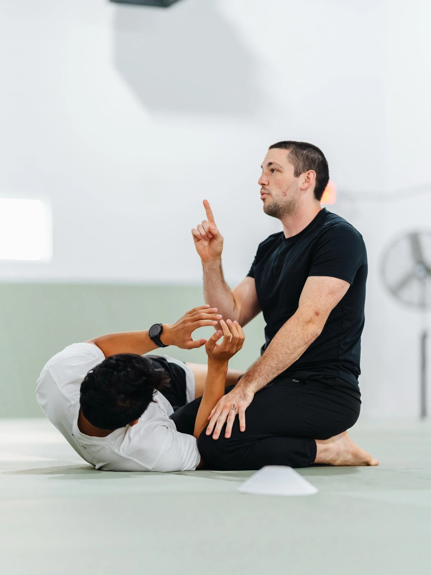 Coach instructing a Jiu-Jitsu technique at Haven Grappling Academy
